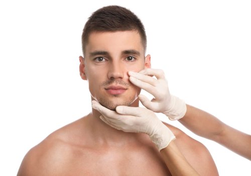 Doctor examining man's face for cosmetic surgery on white background | Medical Spa in Philadelphia, PA | PhillyMedClub